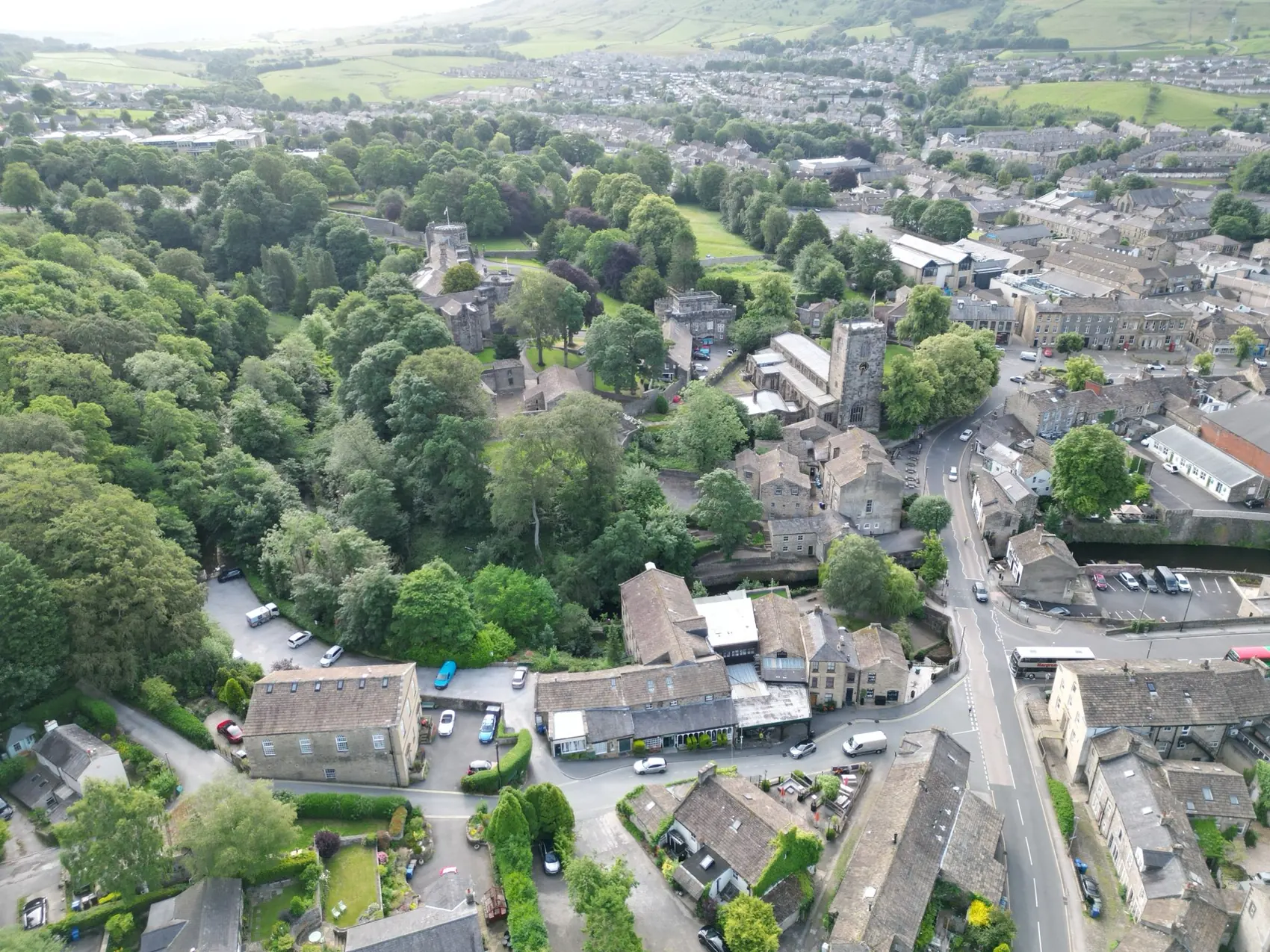 Aerial view over Skipton showing High Corn Mill, the castle and the church, filmed by Halizona